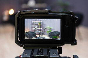 Professional video camera recording a podcast in a modern studio, capturing high-quality audio and video content