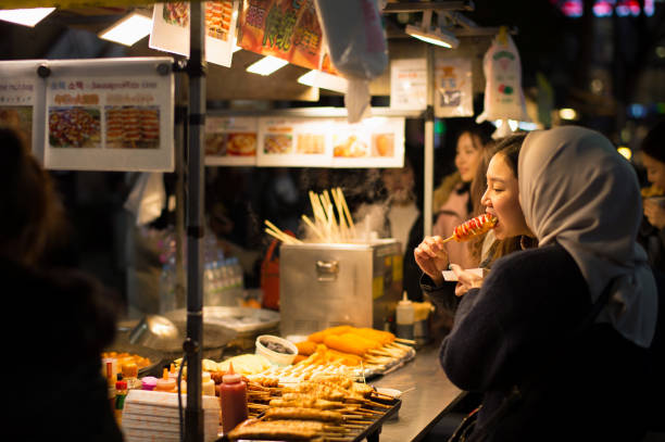 a girl eating korean street foods