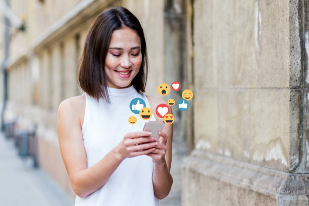 A girl in a white shirt holding a phone