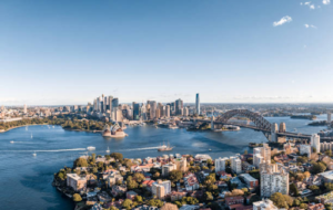 The iconic Sydney skyline displays a mix of famous landmarks, including the Sydney Opera House and Harbour Bridge.