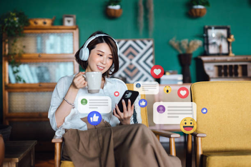 A girl wearing headset and holdiong a mug